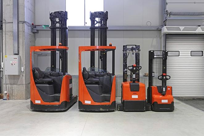 forklifts navigating through narrow aisles in a warehouse